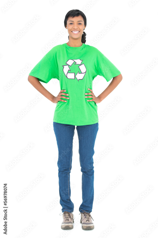Smiling black haired ecologist posing with hands on the hips Smiling black haired ecologist posing with hands on the hips