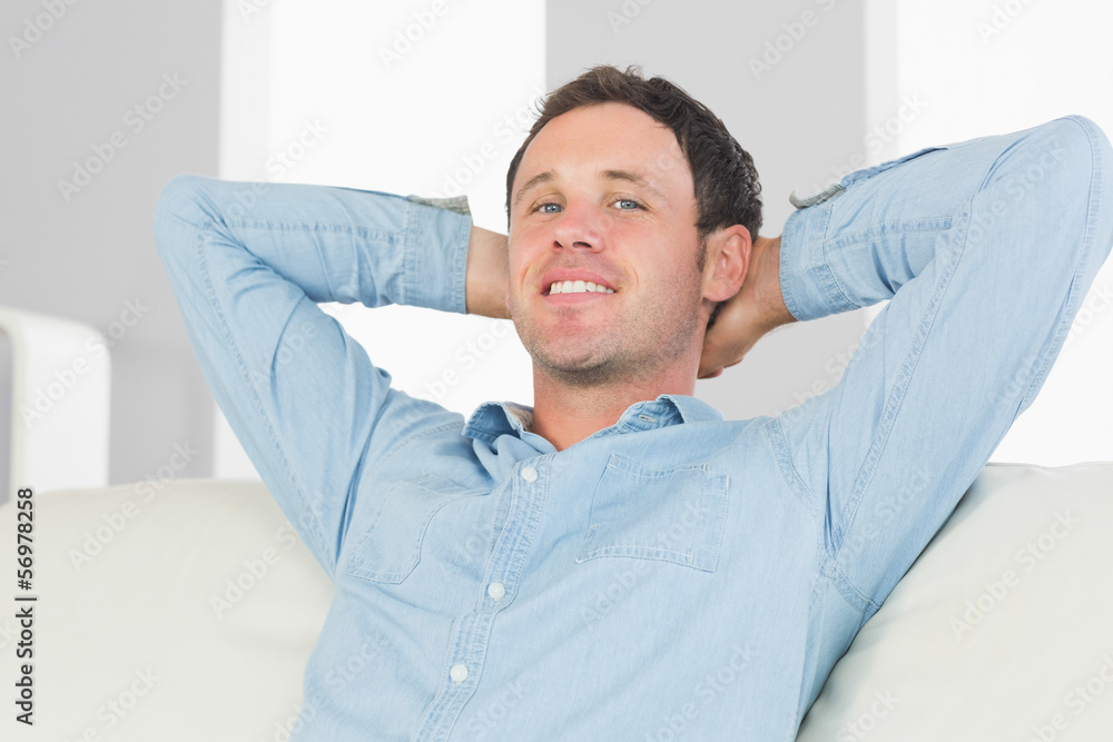 Smiling casual man relaxing with crossed arms Smiling casual man relaxing with crossed arms