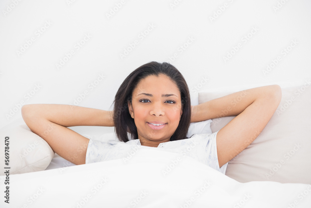 Charming young dark haired model relaxing in her bed Charming young dark haired model relaxing in her bed