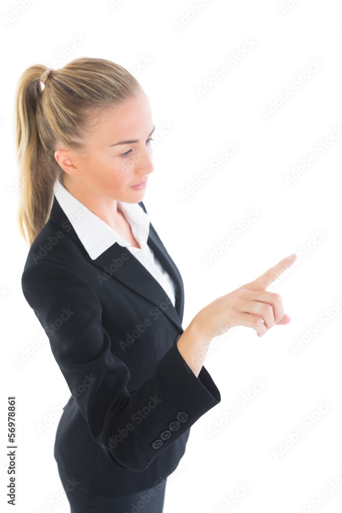 Ponytailed young business woman pointing Ponytailed young business woman pointing