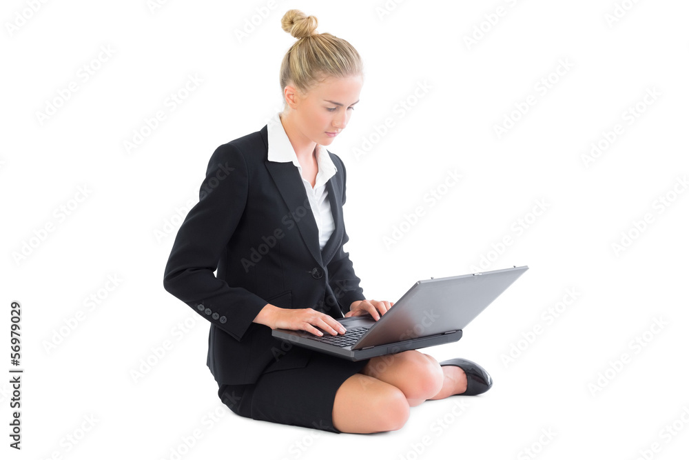 Peaceful young businesswoman working with her laptop sitting on Peaceful young businesswoman working with her laptop sitting on