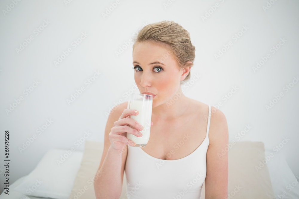 Natural content blonde drinking a glass of milk Natural content blonde drinking a glass of milk