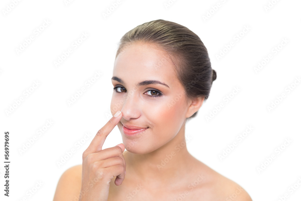 Lovely young brunette woman touching her nose Lovely young brunette woman touching her nose