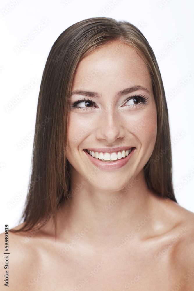 Young woman smiling against white background Young woman smiling against white background
