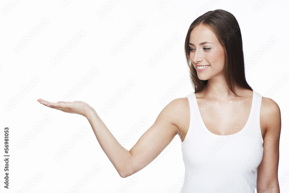 Young woman with arm out against white background Young woman with arm out against white background