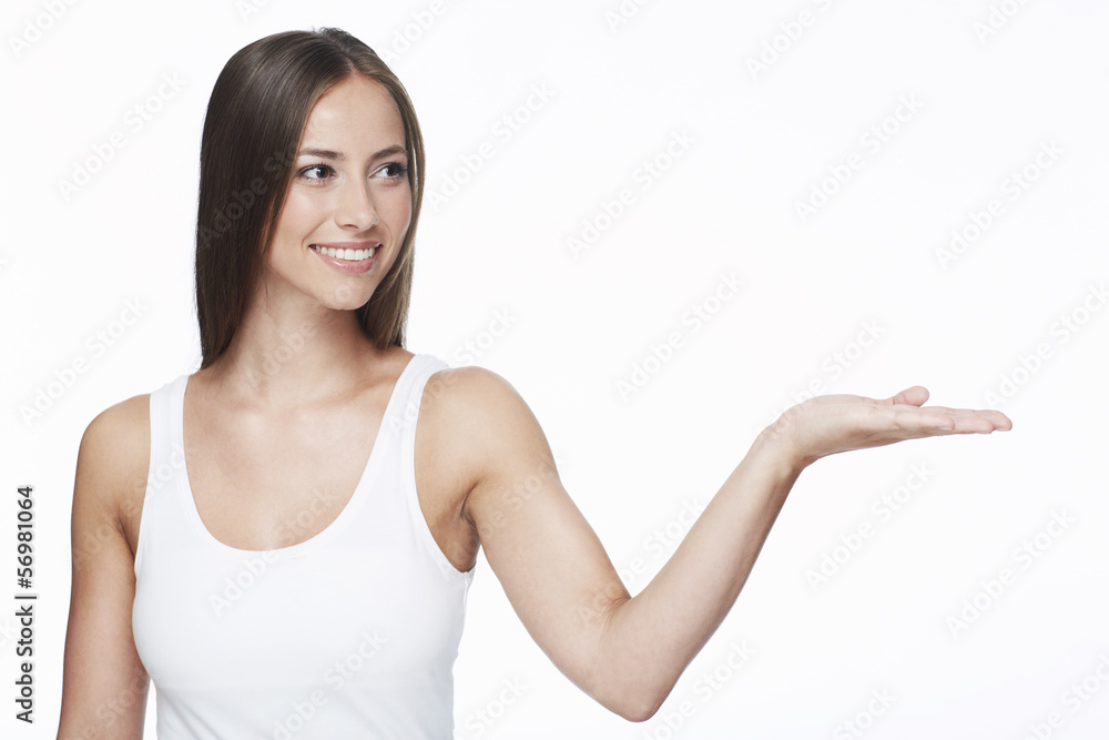Young woman with arm out against white background Young woman with arm out against white background