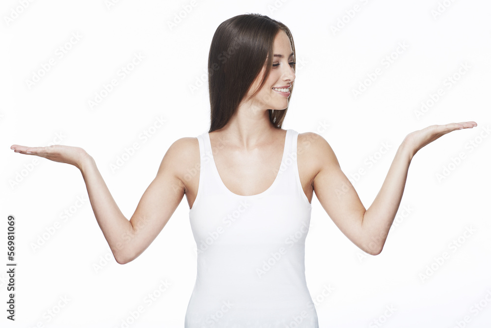 Young woman with arms out against white background Young woman with arms out against white background