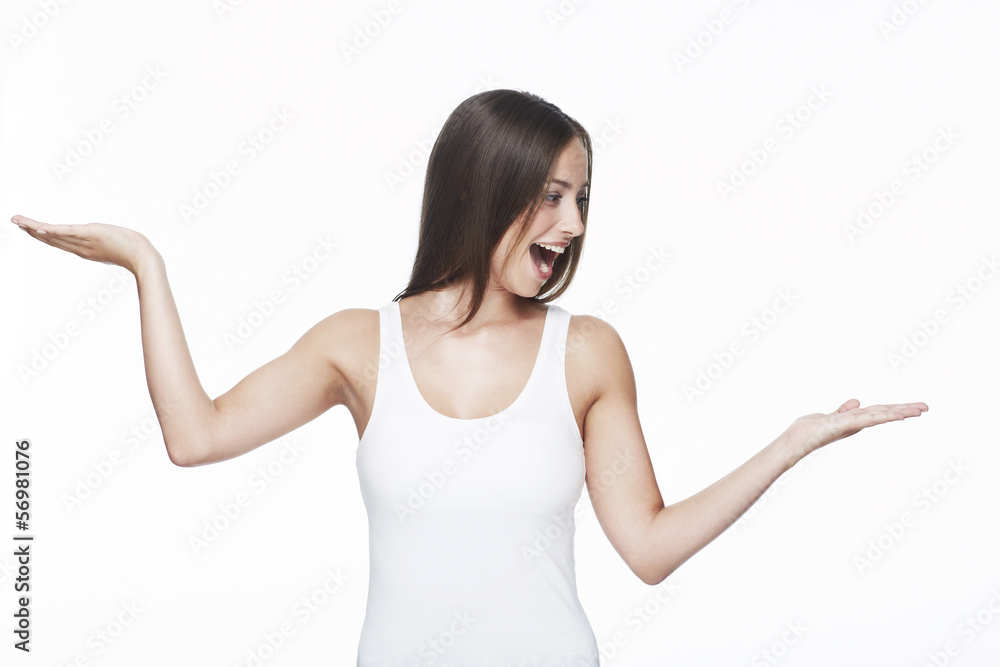 Young woman with arms out against white background Young woman with arms out against white background