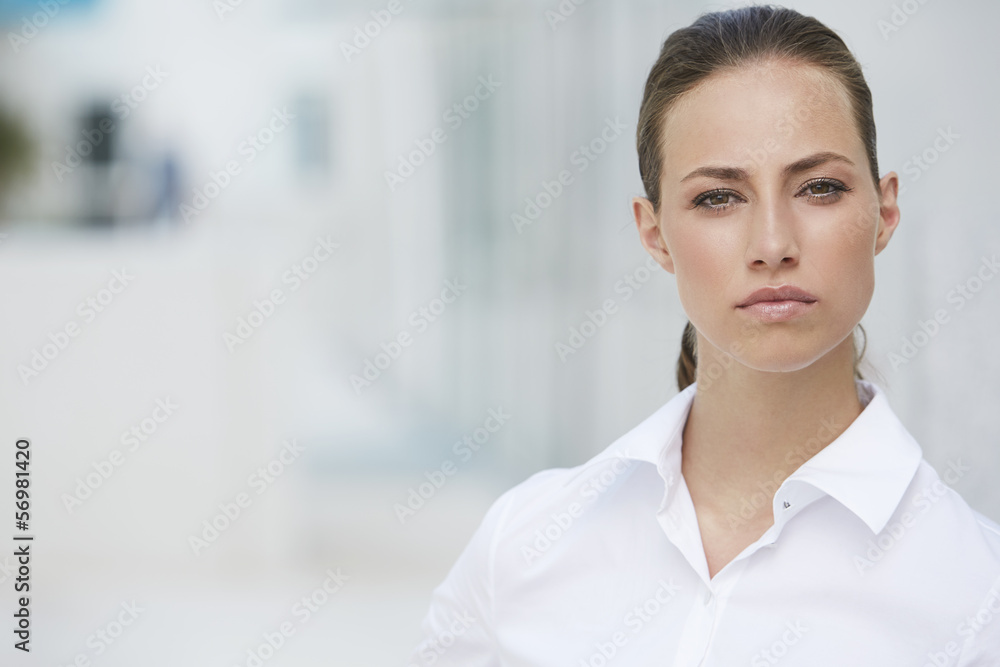 Young businesswoman looking at camera