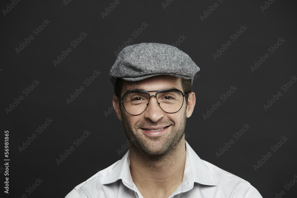 Portrait of mid adult man in sixpence Portrait of mid adult man in sixpence