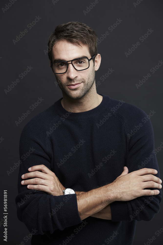 Portrait of mid adult man in glasses, studio