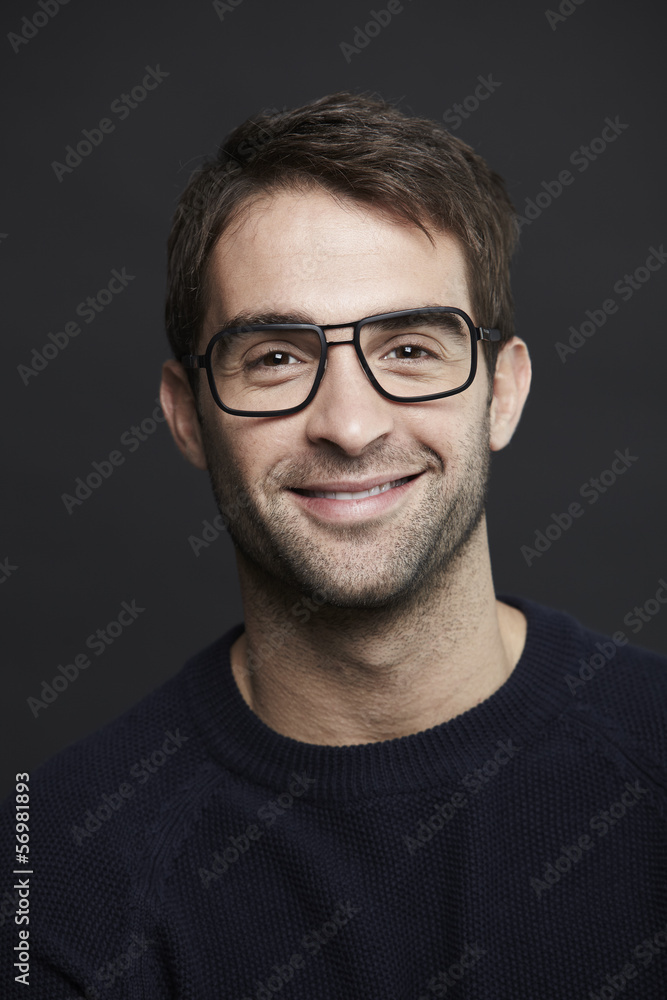 Portrait of mid adult man in glasses, smiling Portrait of mid adult man in glasses, smiling