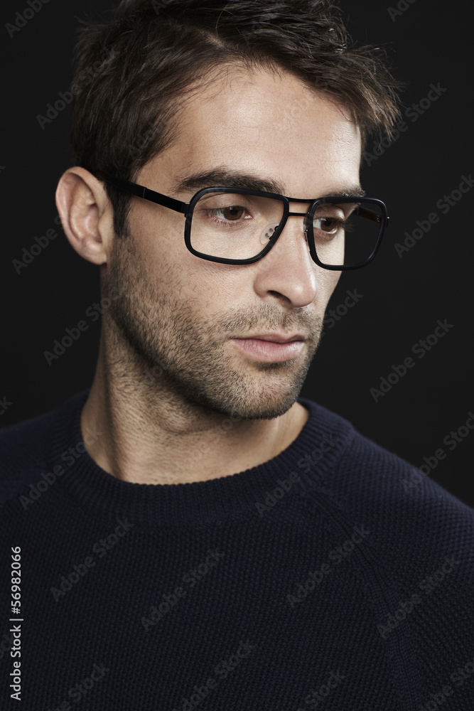 Portrait of mid adult man wearing glasses, looking away Portrait of mid adult man wearing glasses, looking away