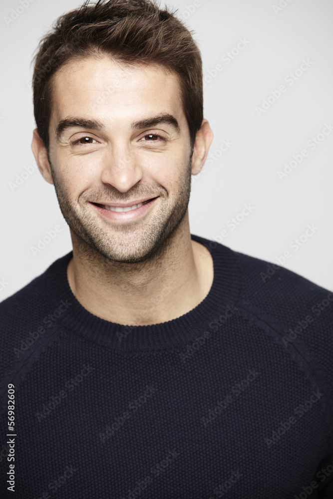 Portrait of mid adult man against grey background Portrait of mid adult man against grey background