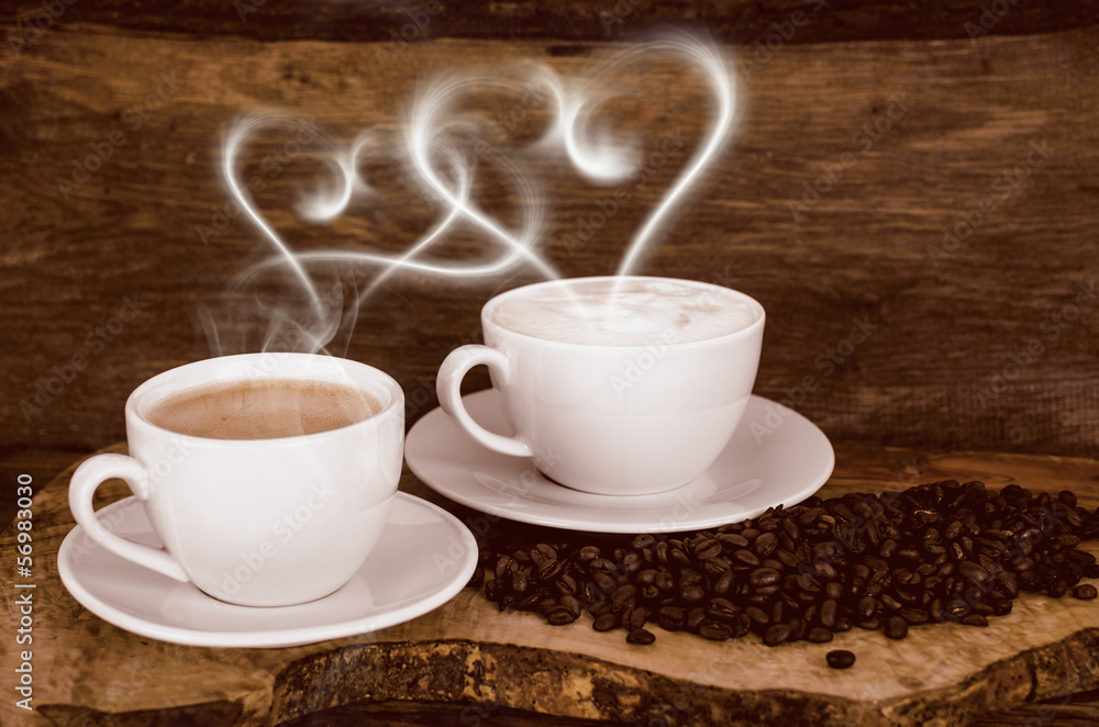 Coffee beans and coffee cup with heart- shaped steam Photos | Adobe Stock