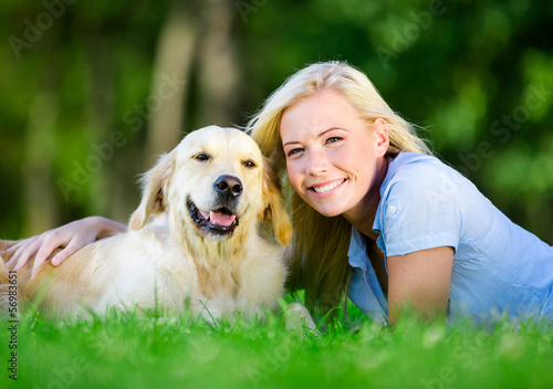 Pretty girl with her arms outstretched having fun at park