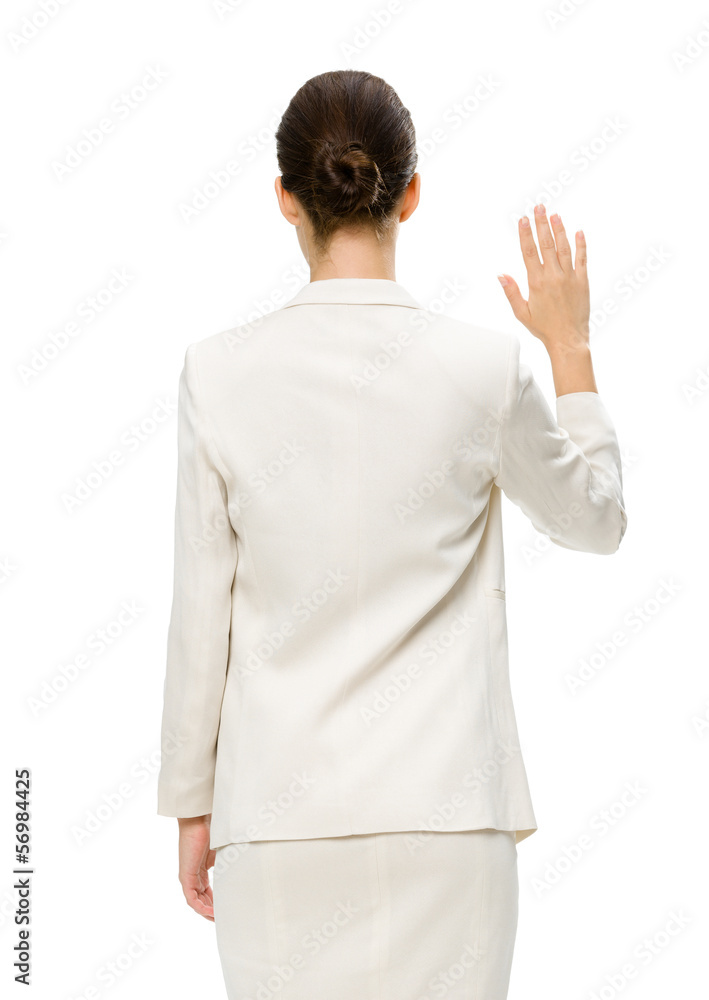 Fototapeta premium Backview of businesswoman waving hand, isolated