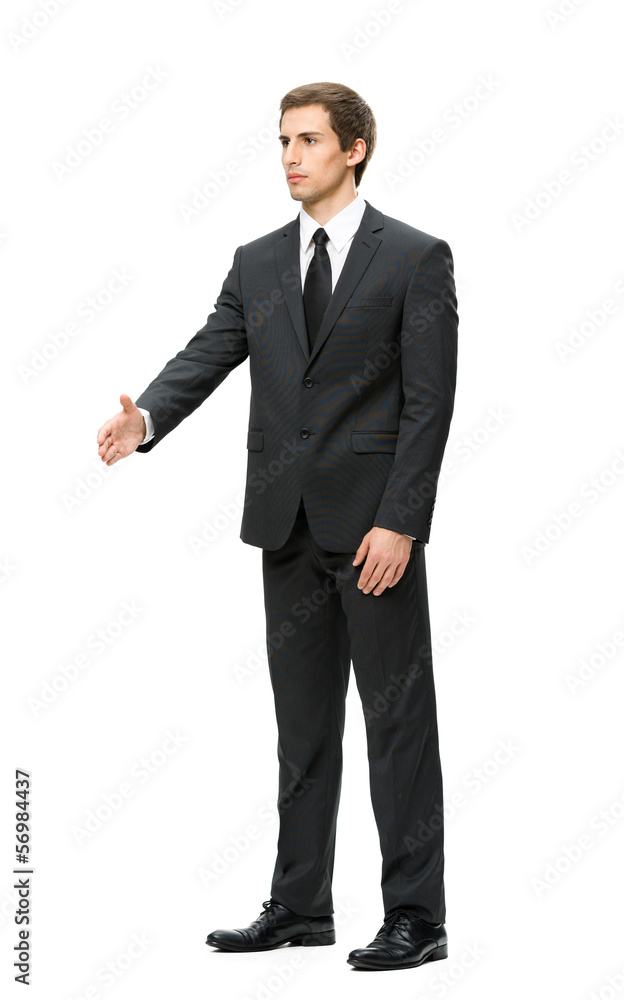 Full-length portrait of businessman handshake gesturing Full-length portrait of businessman handshake gesturing