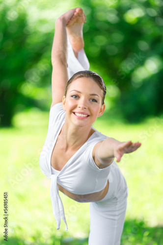 Portrait of female athlete exercising in park