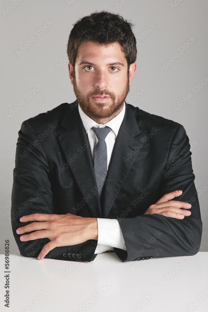 Portrait of a young businessman looking at camera. Portrait of a young businessman looking at camera.