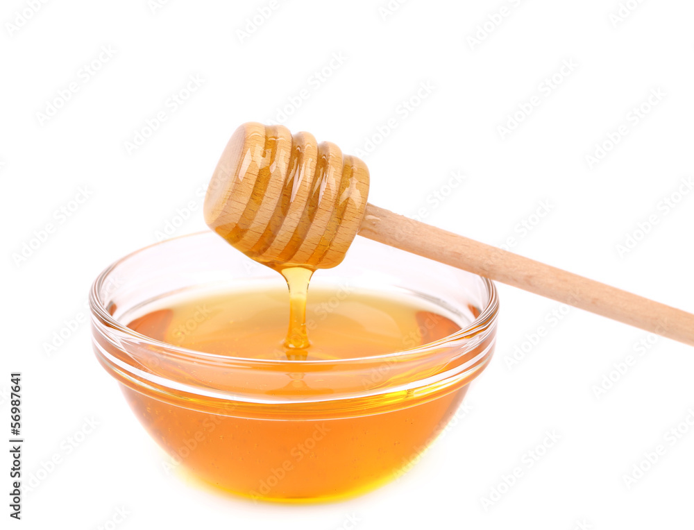 Bow of honey and wooden spoon. Bow of honey and wooden spoon.