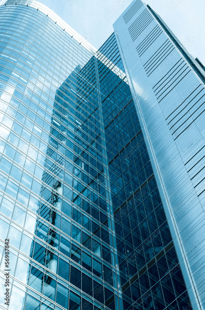 a part of modern business building against blue sky a part of modern business building against blue sky