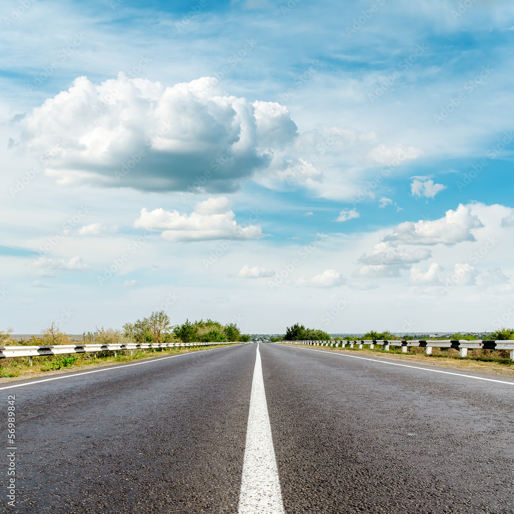 asphalt road and clouds over it asphalt road and clouds over it