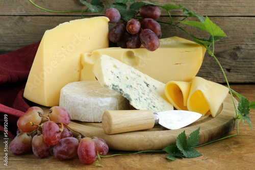 cheeseboard (Maasdam, Roquefort, Camembert) and grapes #56992699