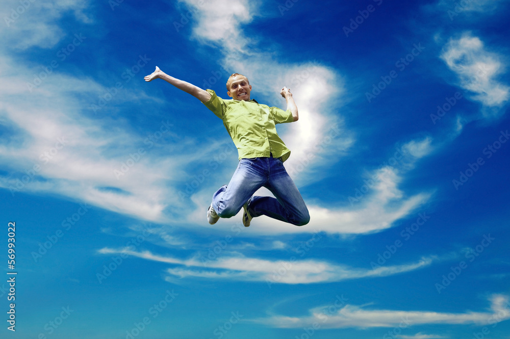 Jump of man under sky with clouds