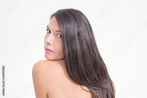 Pretty Woman with long brunette hair and smooth skin