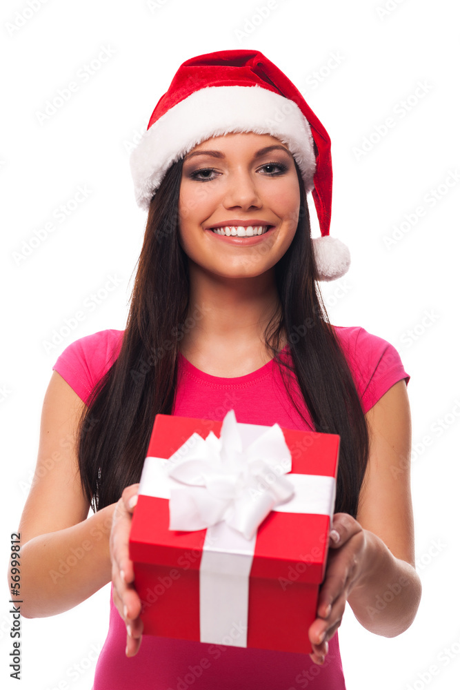 Cute woman with santa hat giving christmas gift Cute woman with santa hat giving christmas gift