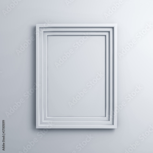 Blank frame on a white wall background with shadow