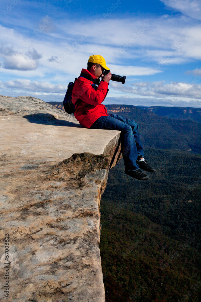 Tourist or photographer taking phots mountain landscape