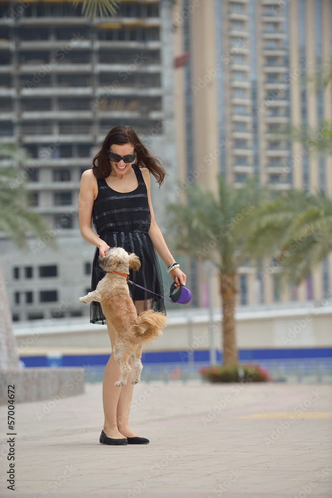 happy young woman with puppy have fun