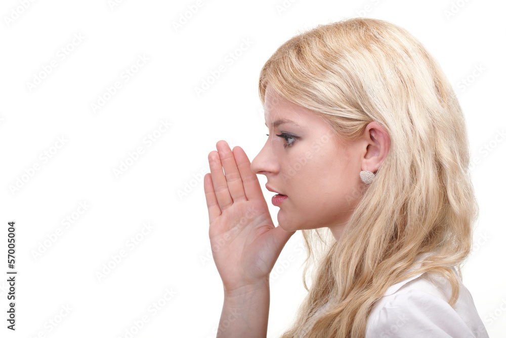 woman eavesdropping with hand behind her ear woman eavesdropping with hand behind her ear