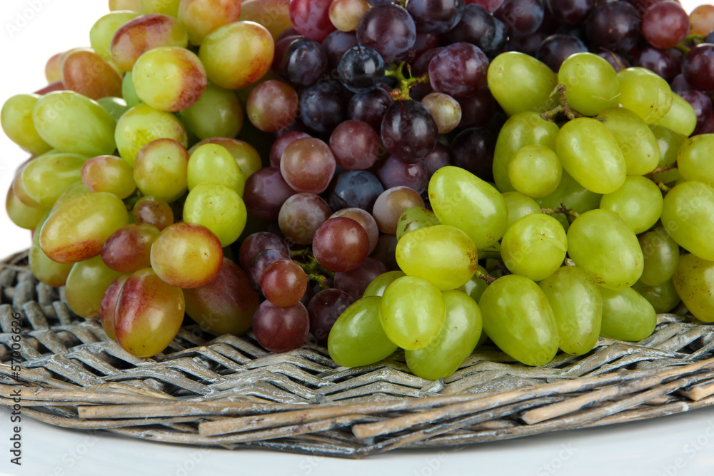 Fresh grape on wicker mat isolated on white Fresh grape on wicker mat isolated on white