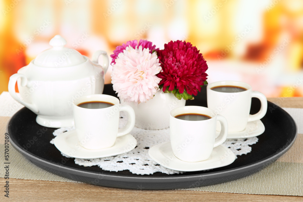 Cups of coffee on tray on table in cafe Cups of coffee on tray on table in cafe