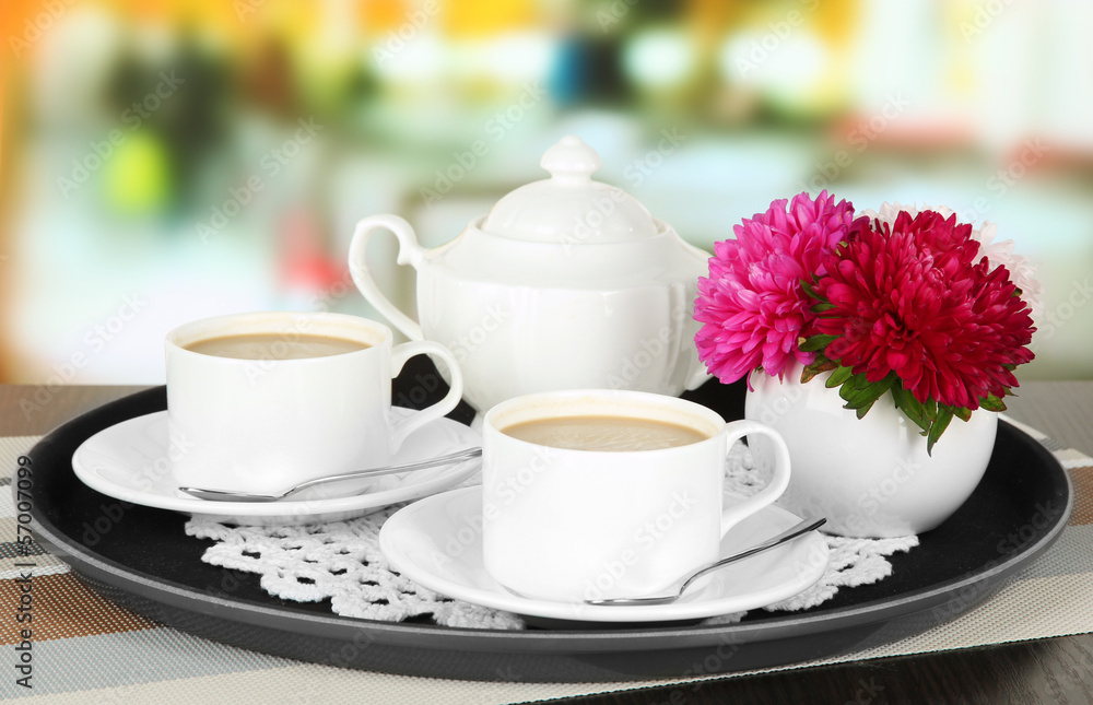 Cups of coffee on tray on table in cafe Cups of coffee on tray on table in cafe
