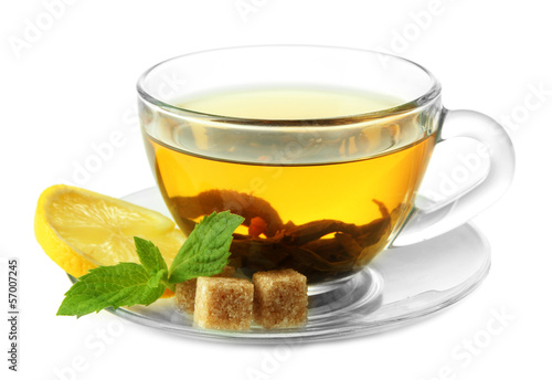 Transparent cup of green tea with lemon and mint isolated