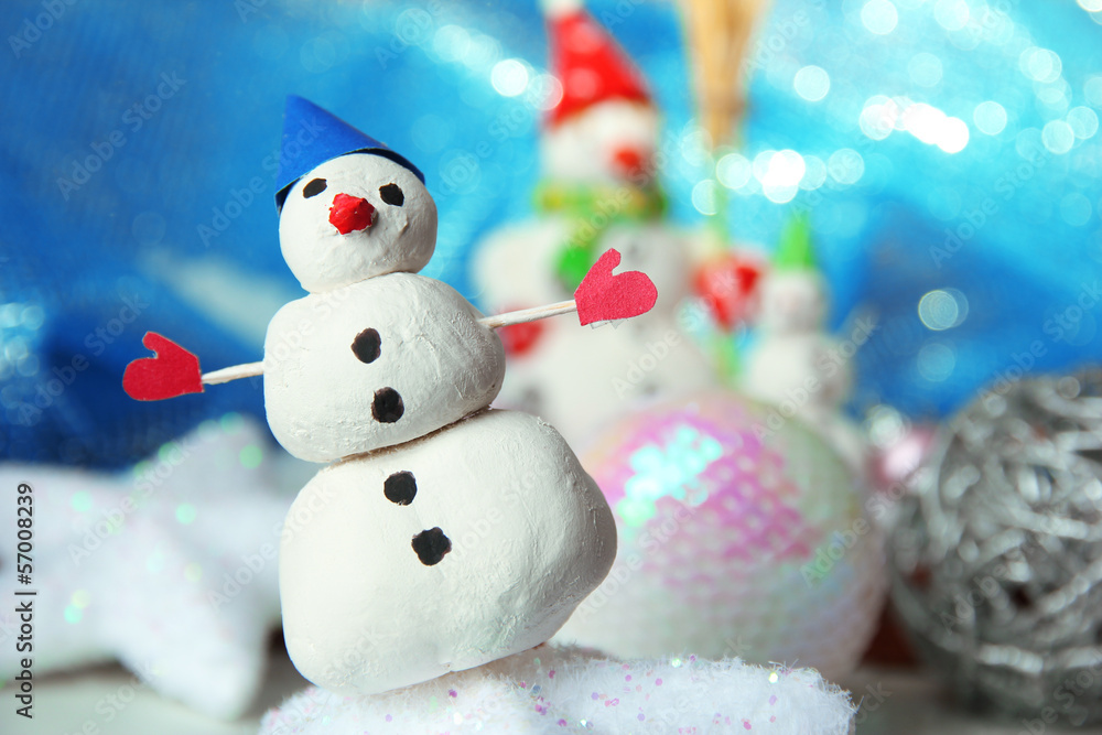 Beautiful snowmen and Christmas decor, on bright background Beautiful snowmen and Christmas decor, on bright background