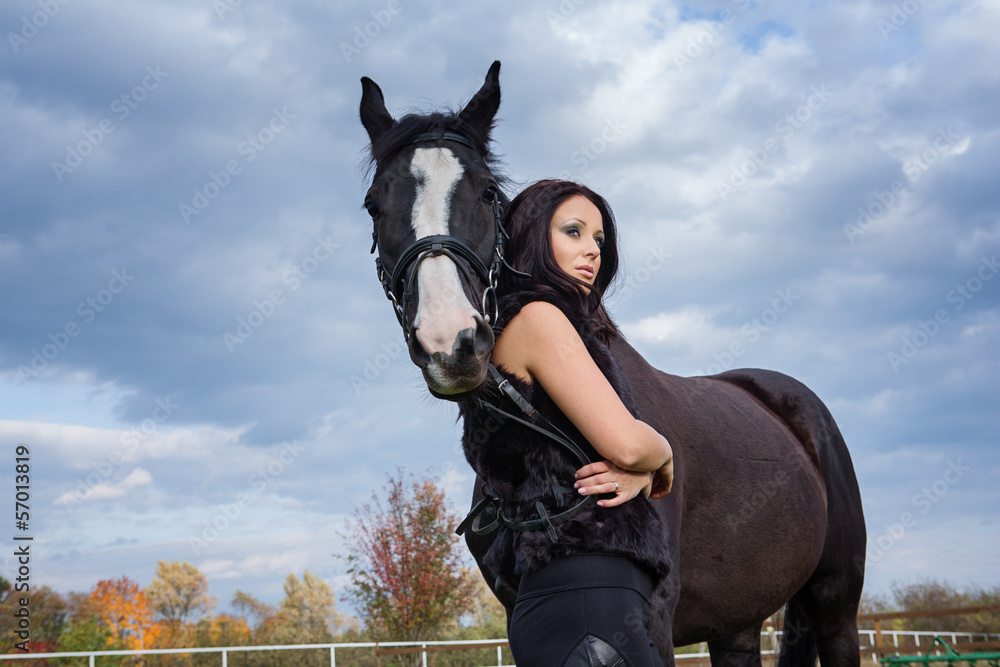 Naklejka premium beautiful woman with horse