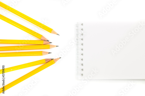 Notebook and pencils with isolated white background