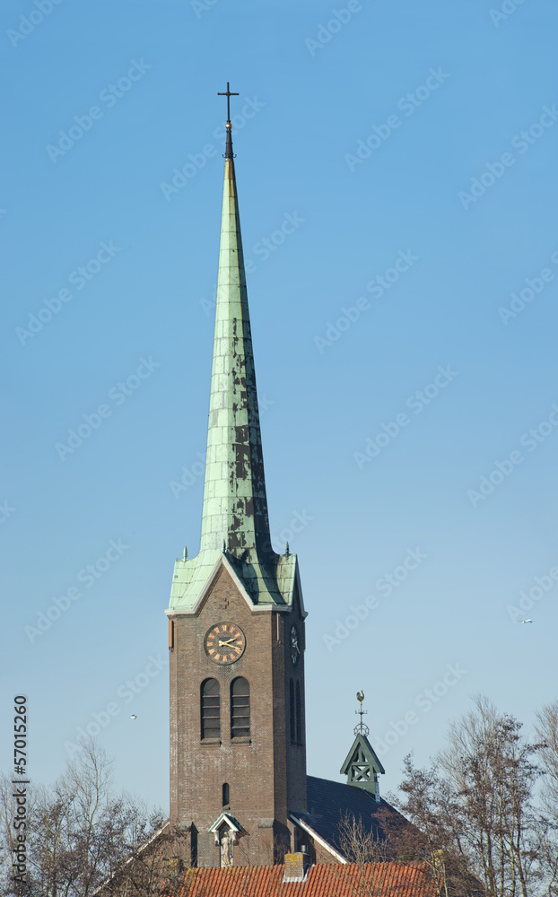 Tall slim Church tower with cross Tall slim Church tower with cross