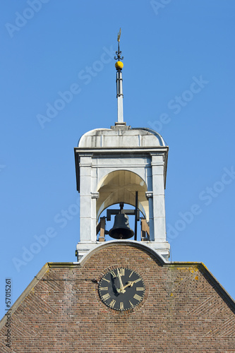 Wooden belfry clock bell and windvane photo