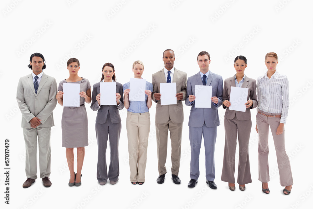 Business people holding six supports for letters Business people holding six supports for letters
