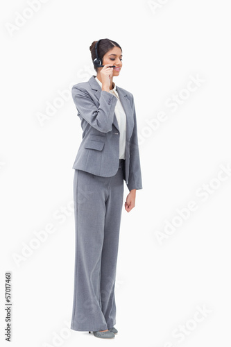 Standing call centre agent with headset