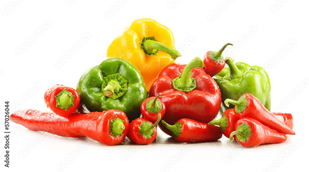 Composition with assorted peppers isolated on white background