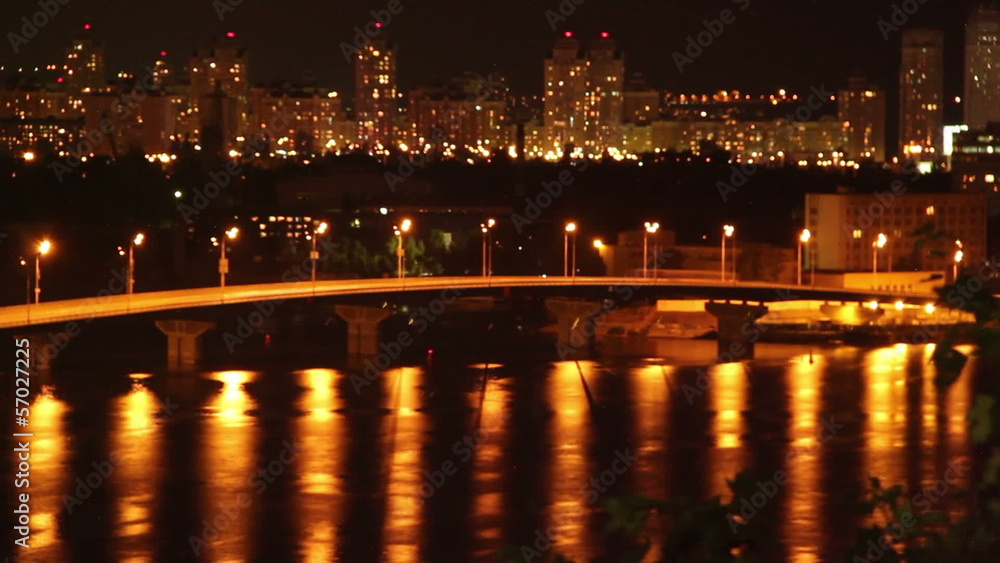 Night sleeping city cars drive on bridge yellow light reflection Night sleeping city cars drive on bridge yellow light reflection