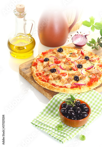 Pizza surrounded by the ingredients