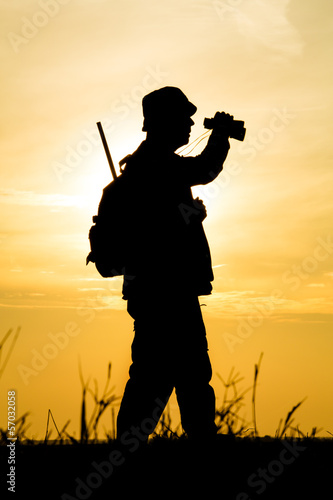 Hunter With Shotgun in Sunset